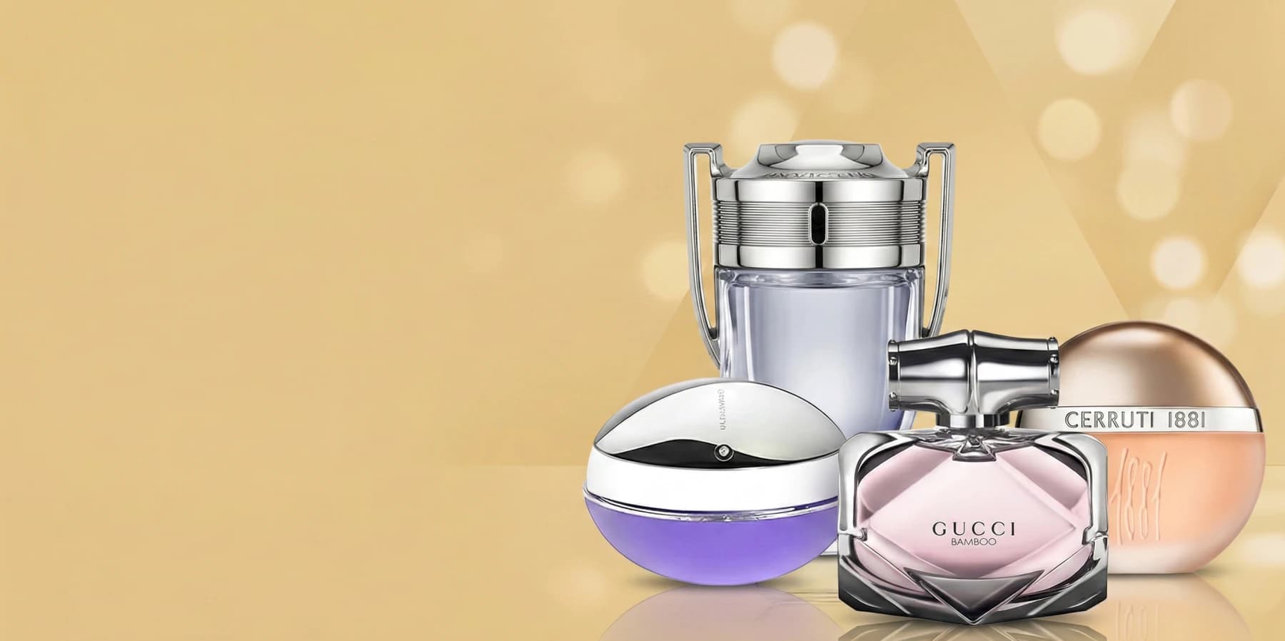 Luxury fragrance bottles arranged on a warm gold background
